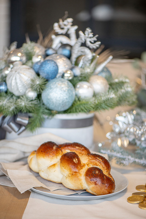 Image: bread on a plate on a table decorated for Christmas